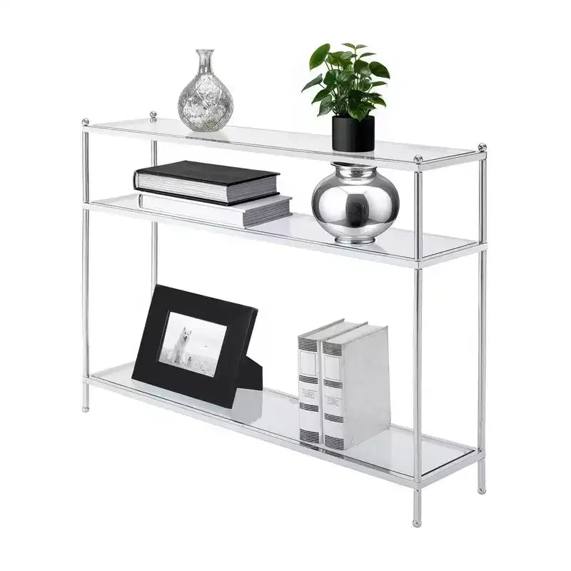 Un meuble d'entrée à trois niveaux et une console étroite contre le mur du salon.
